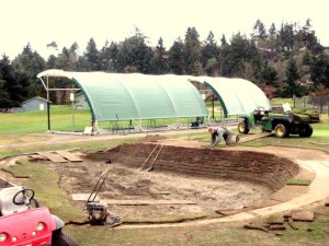 The Fairwinds' grounds crew redesigning the sod face bunker 